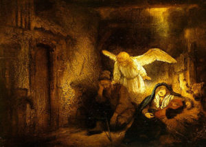 A dark, brown-tones manger is lit by an angel hovering over the slump-sleeping Joseph's shoulders; Mary in blue is off to the other side, leaning against the straw manger.